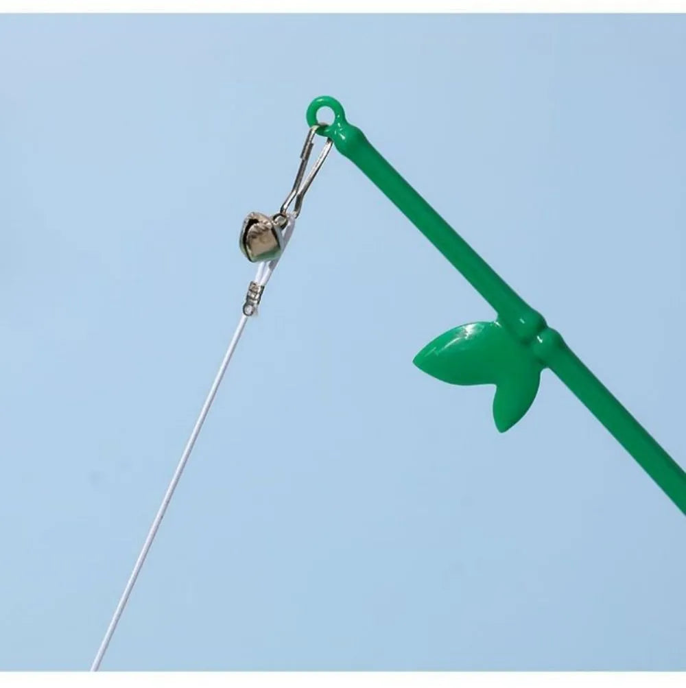 Green interactive cat feather wand toy with bell attachment on a durable stick