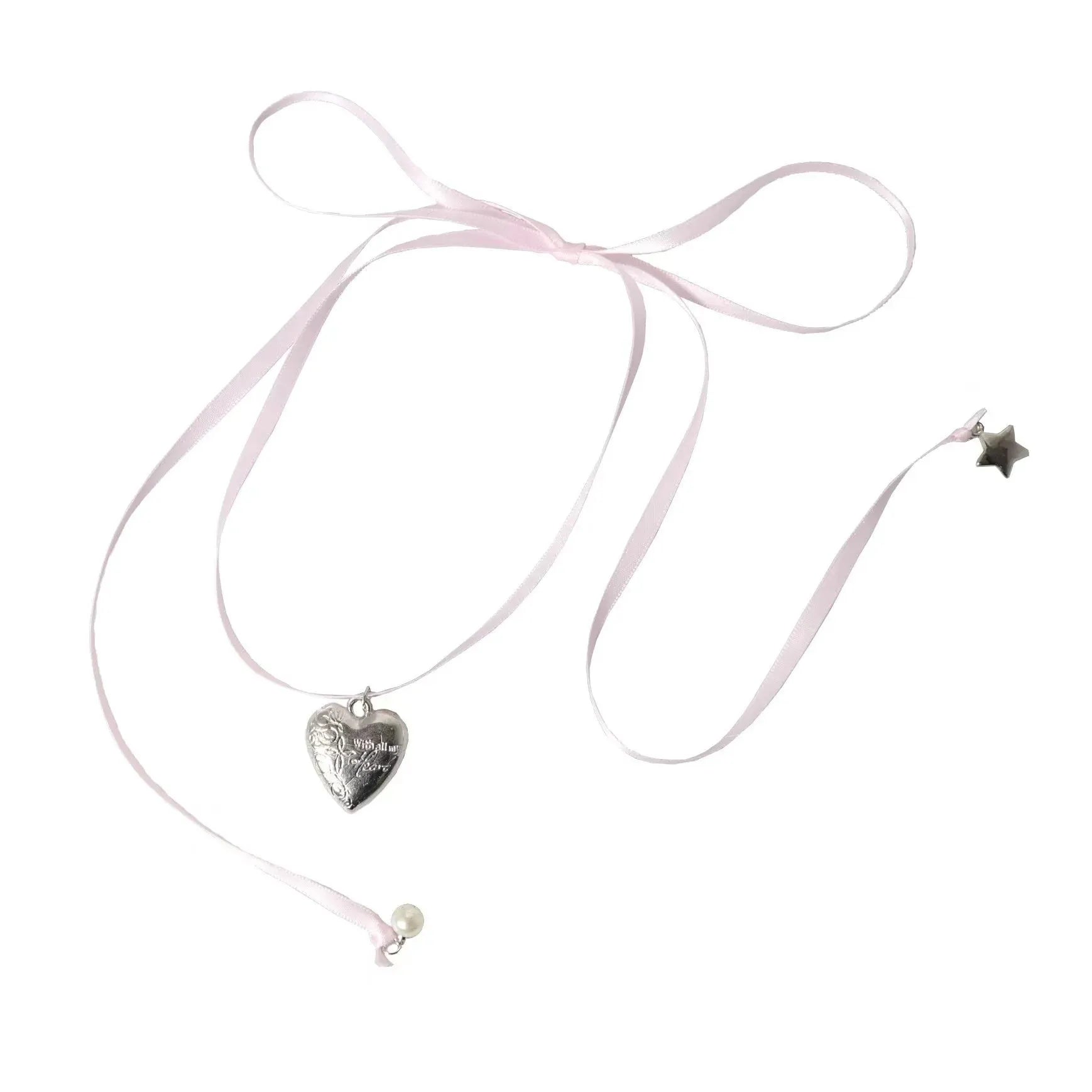 Close-up of a women's alloy fashion necklace with a love pendant and ribbon detail on a delicate clavicle chain.