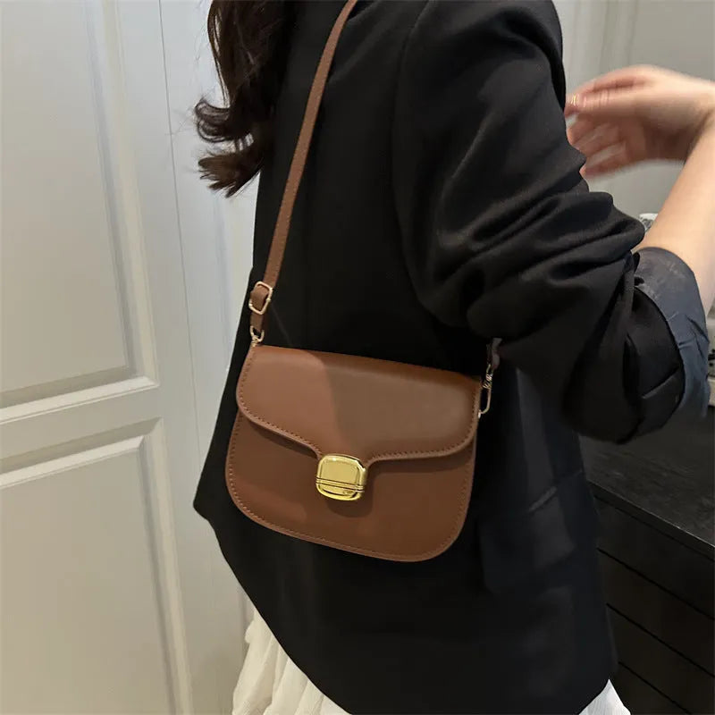 Simple PU leather women's handbag in khaki with internal zipper pocket and phone compartment.