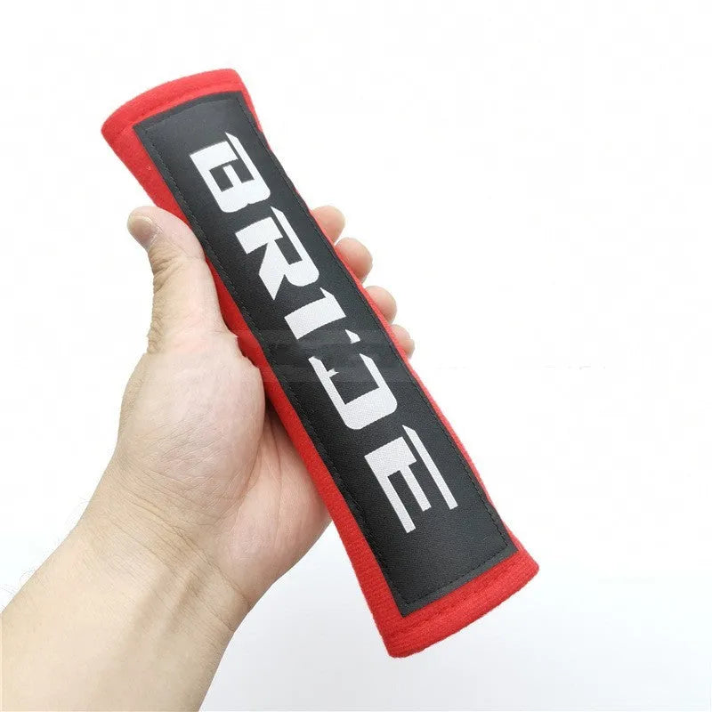 Car seat belt shoulder pads in black, blue and red options with cotton sponge cloth construction