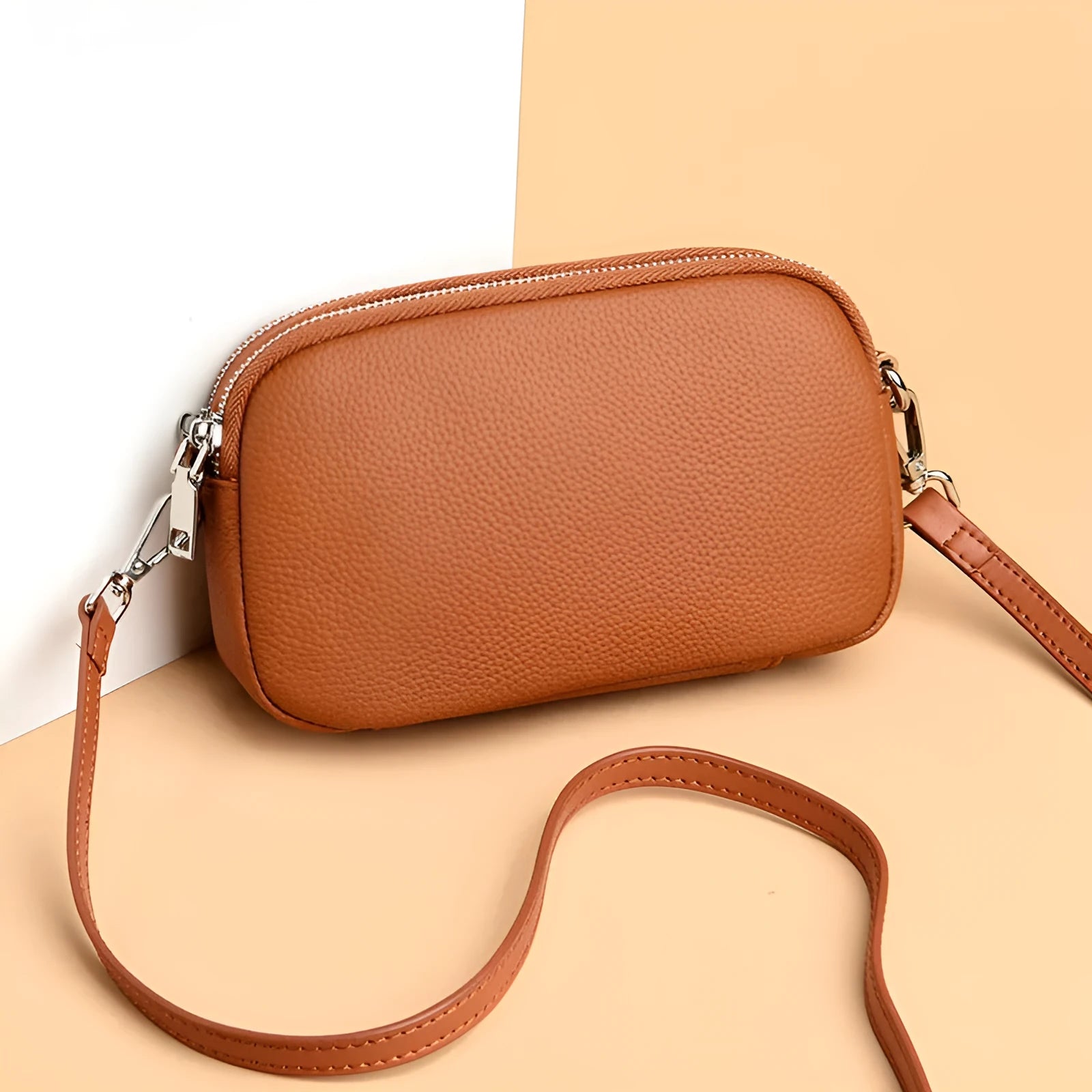 Small square shoulder messenger bag in first layer cowhide with sewing line detail