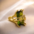 Lady's gold toned zinc alloy ring with navy blue inlaid diamond style stone