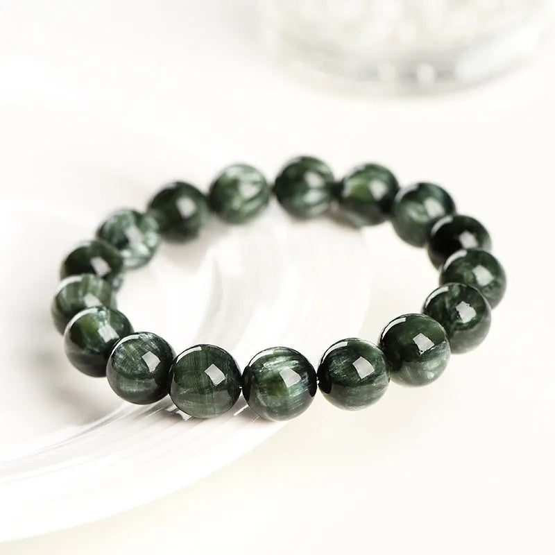Natural Green Dragon Crystal round bead bracelet with 8-9mm beads and a Ruyi charm.