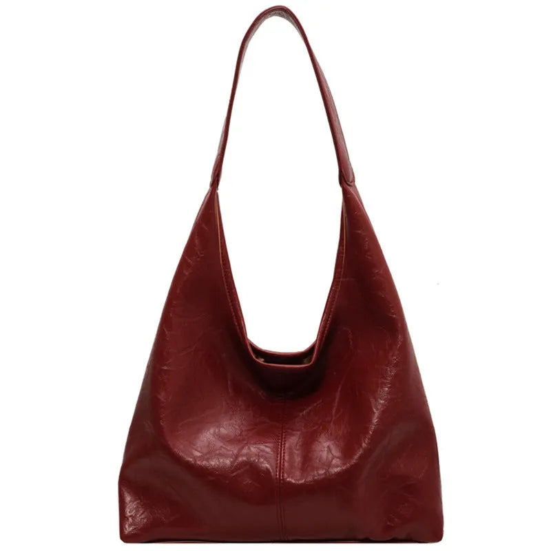 Soft PU leather large capacity shoulder bag in black with a sandwich pocket and contrasting stitching.