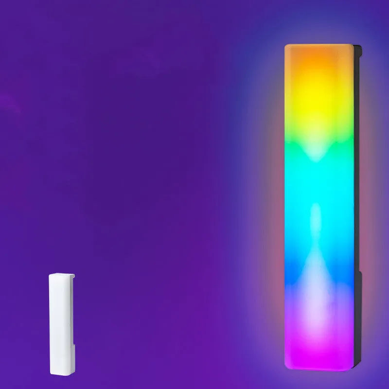 3D RGB music rhythm table lamp with voice control in black or white shell on a desk.