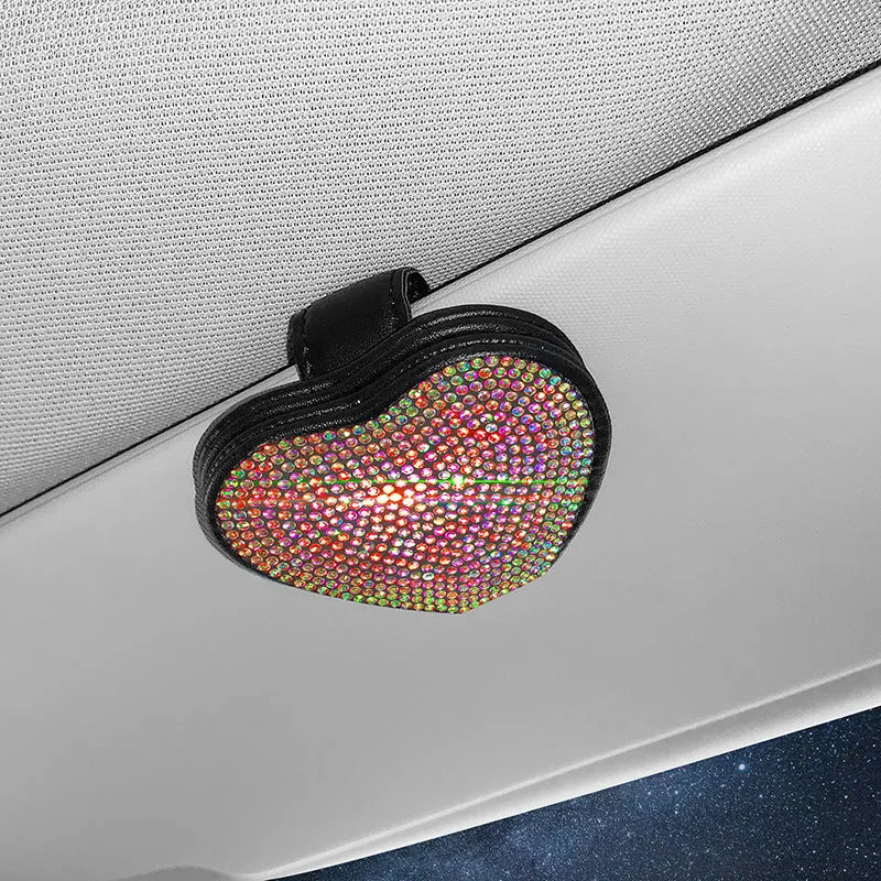 Black PU leather magnetic storage clip with diamond encrustment, shown attached to a car sun visor.