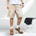 Light blue men's denim shorts with ripped details and a straight-leg fit