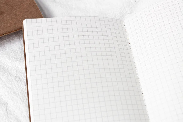 Diary refill inner core showing saddle stitch binding and 11x21cm dimensions
