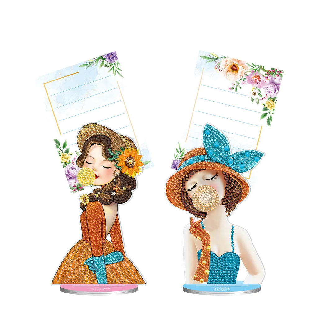 Handmade diamond painting decorative note clip on a desktop.