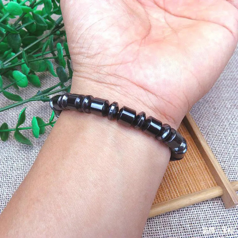 Black pentagram magnetic therapy bracelet with magnetite and hematite stones on stretch band