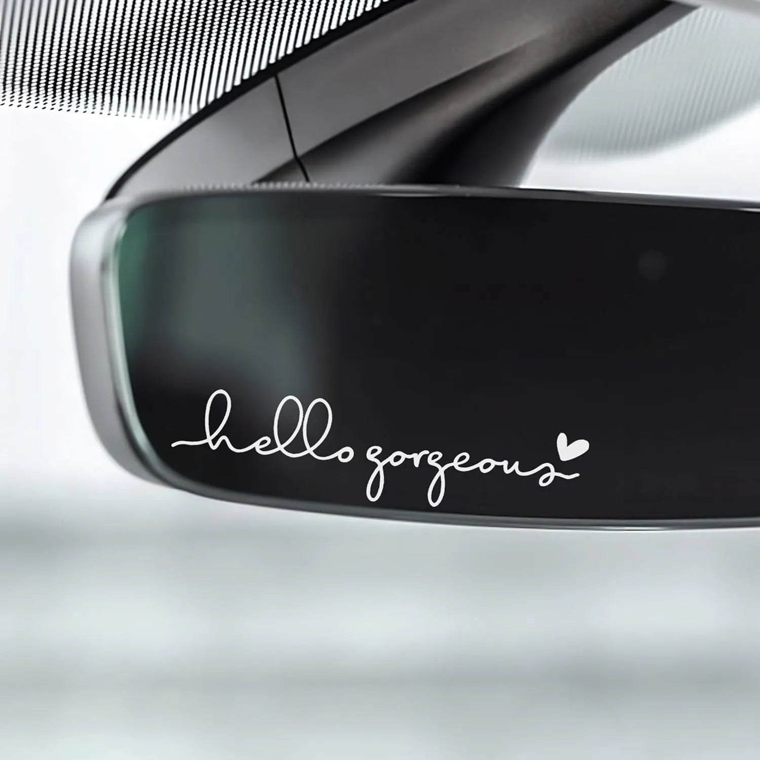 Plastic rearview mirror sticker 10x3cm in black on a car mirror