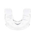 Transparent silicone denture model on a clean surface with natural light showing clear tooth structure