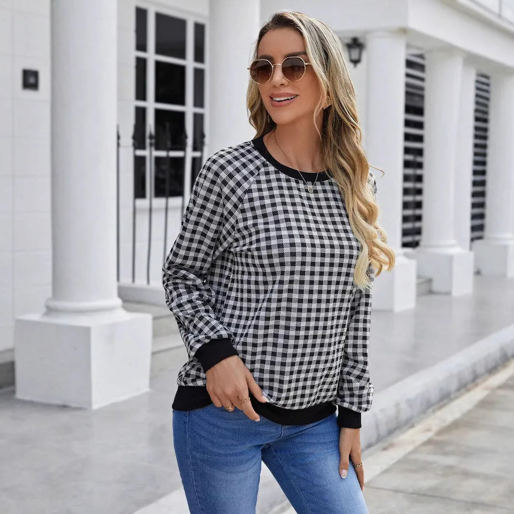 Black long sleeve pullover sweater with a classic plaid stripe print pattern.