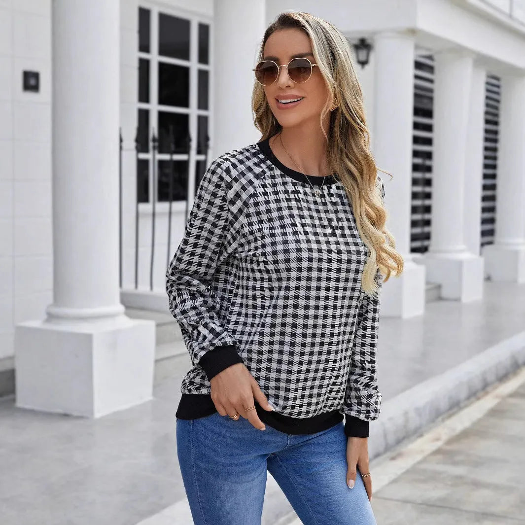 Black long sleeve pullover sweater with a classic plaid stripe print pattern.