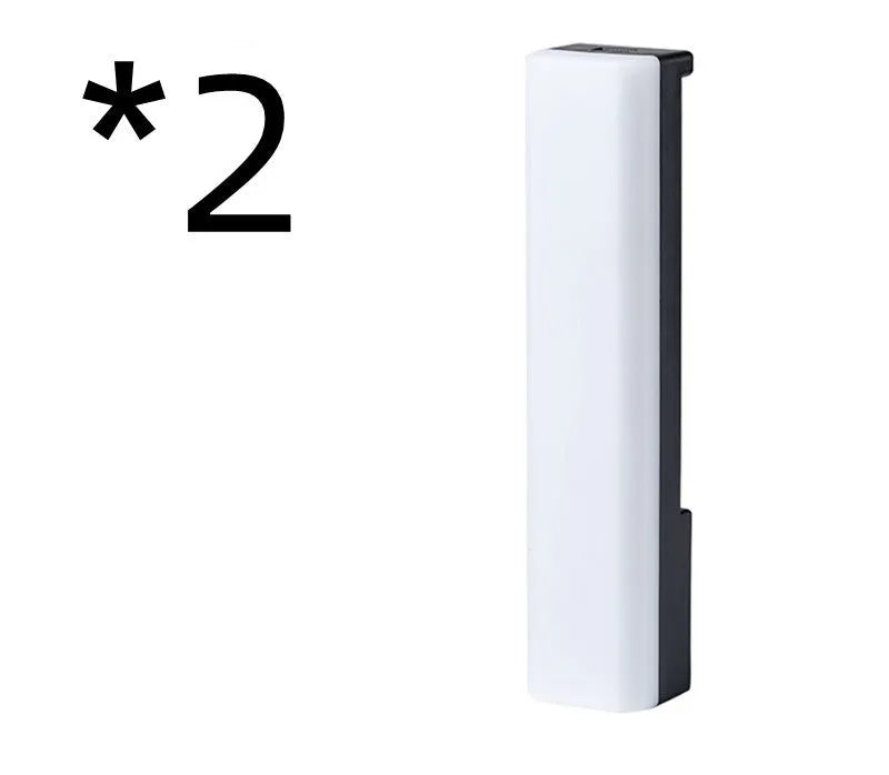 3D RGB music rhythm table lamp with voice control in black or white shell on a desk.