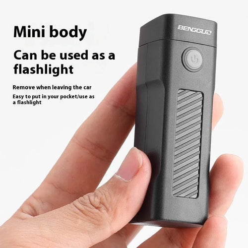 A black USB rechargeable bicycle headlight mounted on handlebars with a quick-release strap.