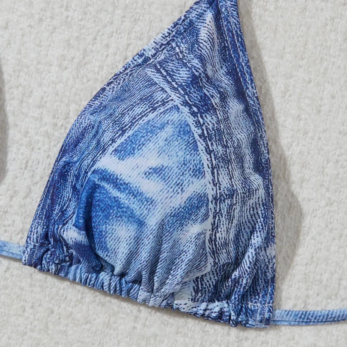 Women's denim blue printed bikini set with strap detail, made from nylon spandex fabric.