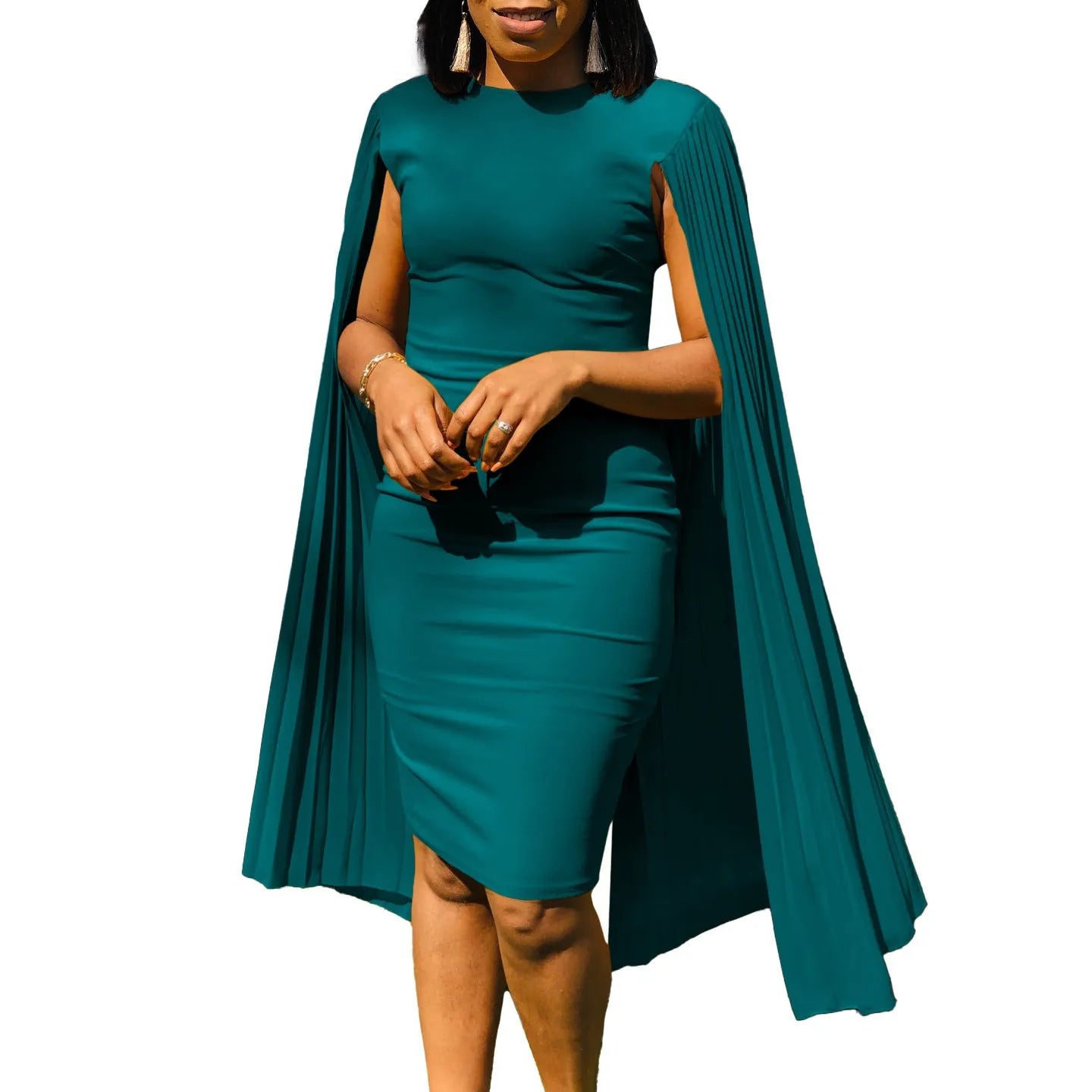 Yellow high-waisted evening gown with long sleeves and a full pleated skirt, model standing formally.