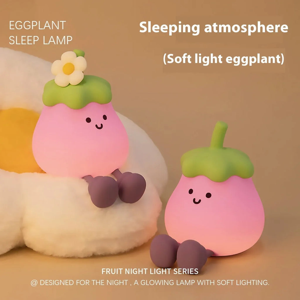 Cartoon eggplant small night lamp with soft yellow light beside broccoli design night light