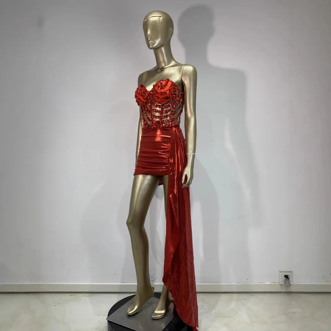 Red women's spandex skirt suit with see-through hollow mesh panels for stage performance.