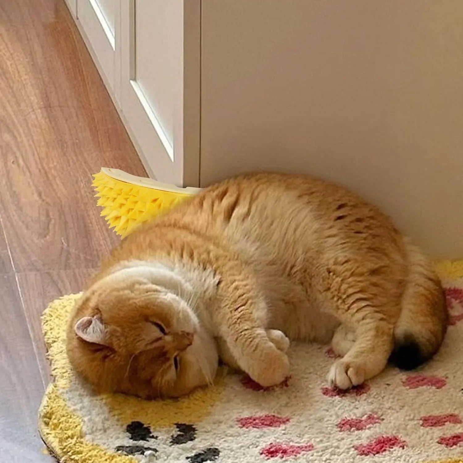 Yellow durian-shaped cat corner scratcher and massage comb toy for indoor cats.