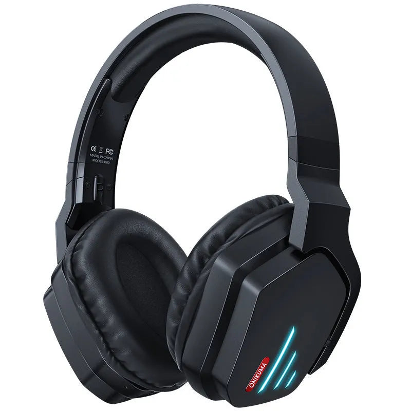 Luminous black wireless over-ear headphones with headband, shown with included 3.5mm cable and dust bag.