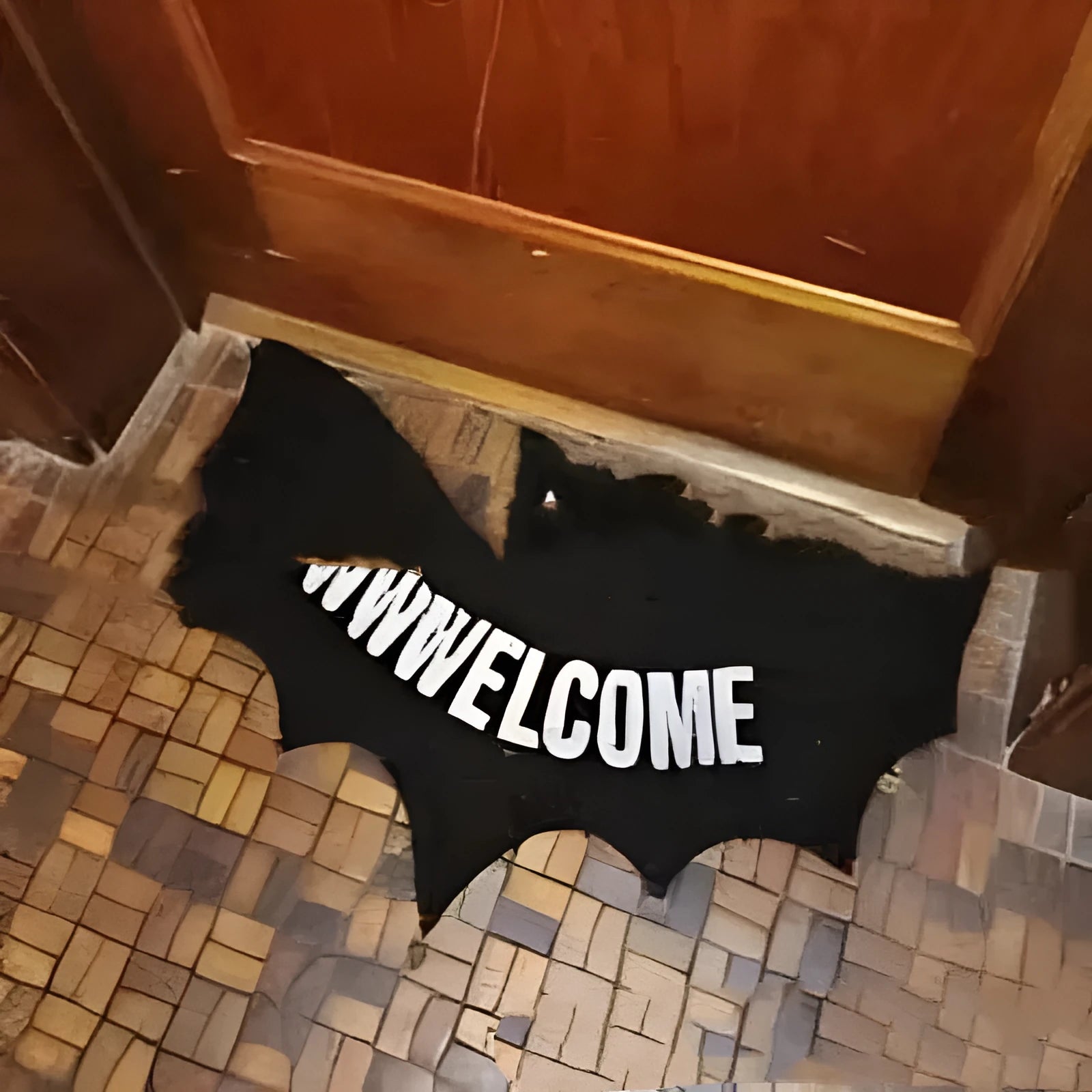 Bat-shaped plastic doormat measuring 80x40 centimetres in bat mat style