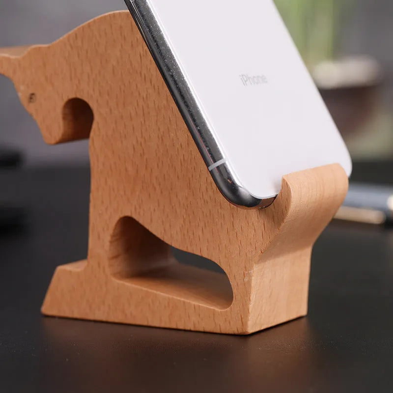 Handcrafted beech wood and resin lazy bracket mobile phone holder on a wooden desk