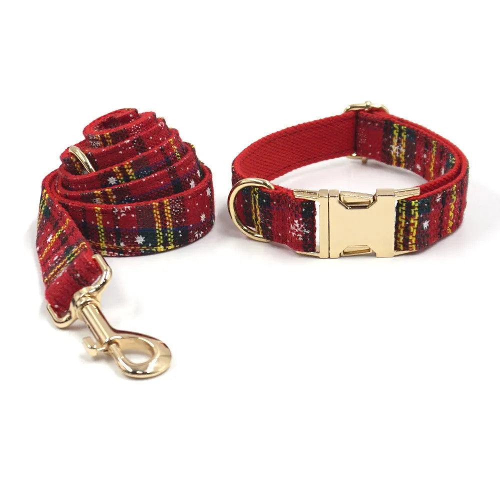 Red Christmas dog suit set with collar, leash, bow, and chest-back harness on a festive background.