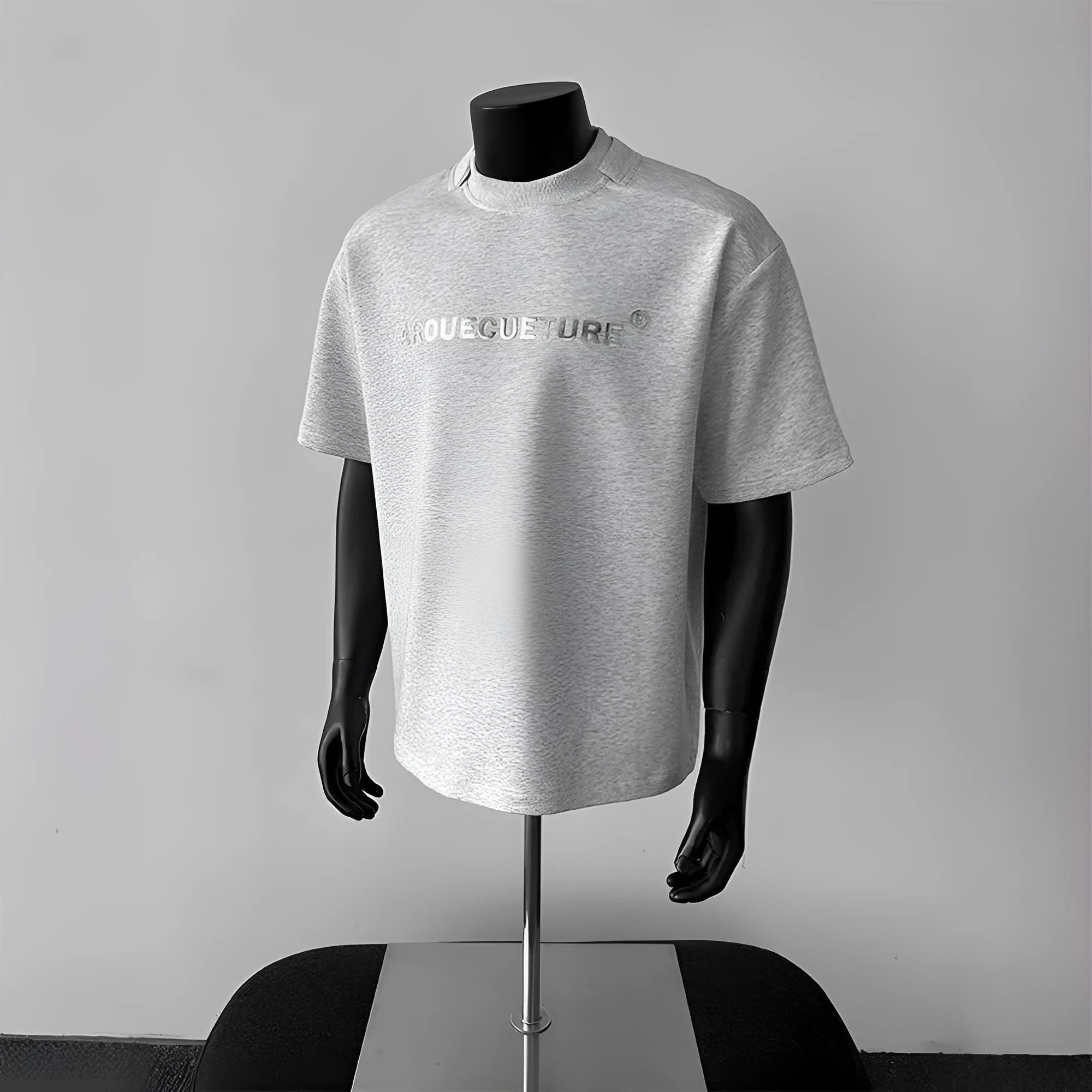 Men's loose short sleeve cotton t-shirt with printed letters in light grey.