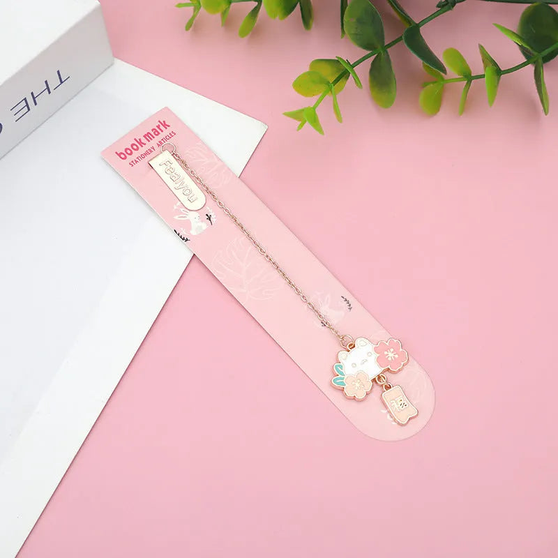 Metal pendant bookmark with engraved cherry blossom cat design, small decorative charm for book marking