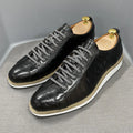 Men's low-top white shoes with embossed pattern texture on the front, featuring front-tie laces.