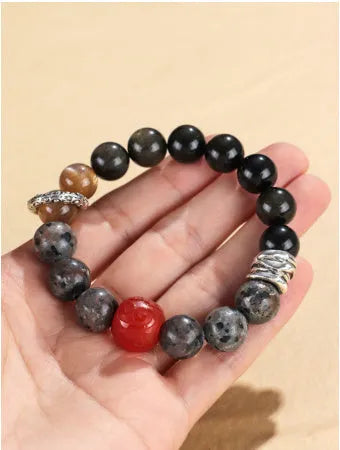 Handcrafted red agate and golden obsidian Wukong bracelet with flame stone pattern