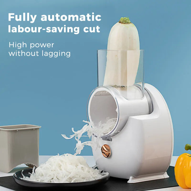 White electric vegetable slicer with rotary grater and suction base on a kitchen counter.
