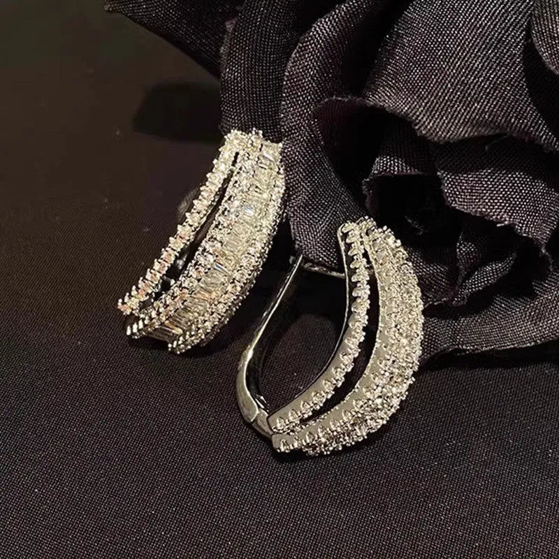 Women's geometry-shaped stud earrings with zircon detailing in white gold colour