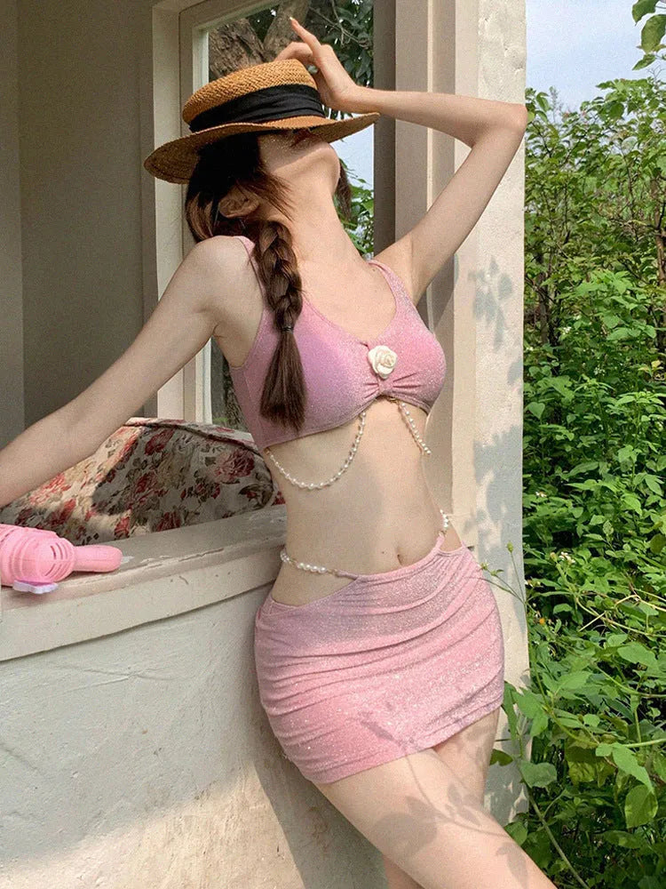 Women's pink and black three-piece bikini swimsuit with briefs styling