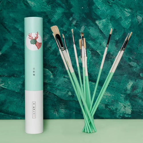 Set of acrylic gouache painting brushes including fan brushes, wide brush and detail brushes in animal-themed designs