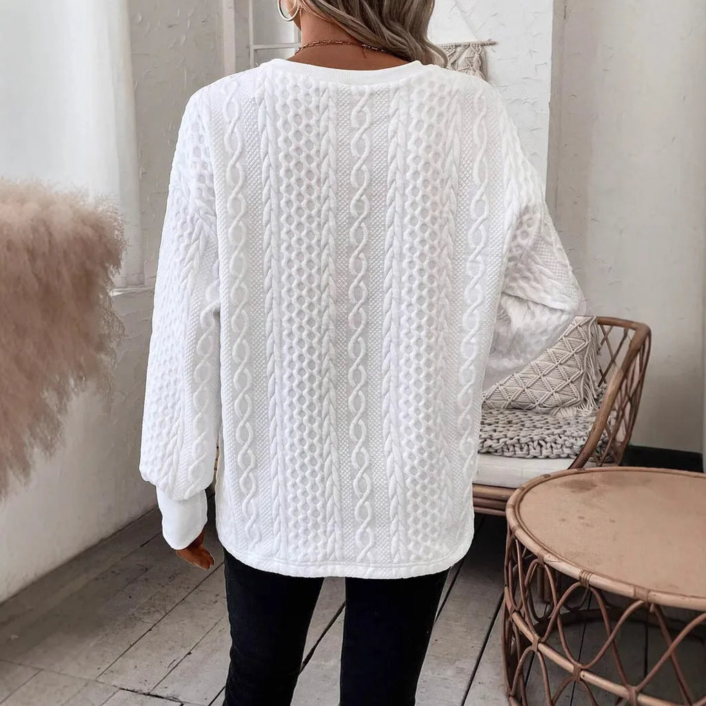 Milky white loose long sleeve T-shirt with a textured 3D pattern on the front.