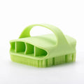 Blue silicone scalp massager brush with hand-strap handle for washing and massaging hair.