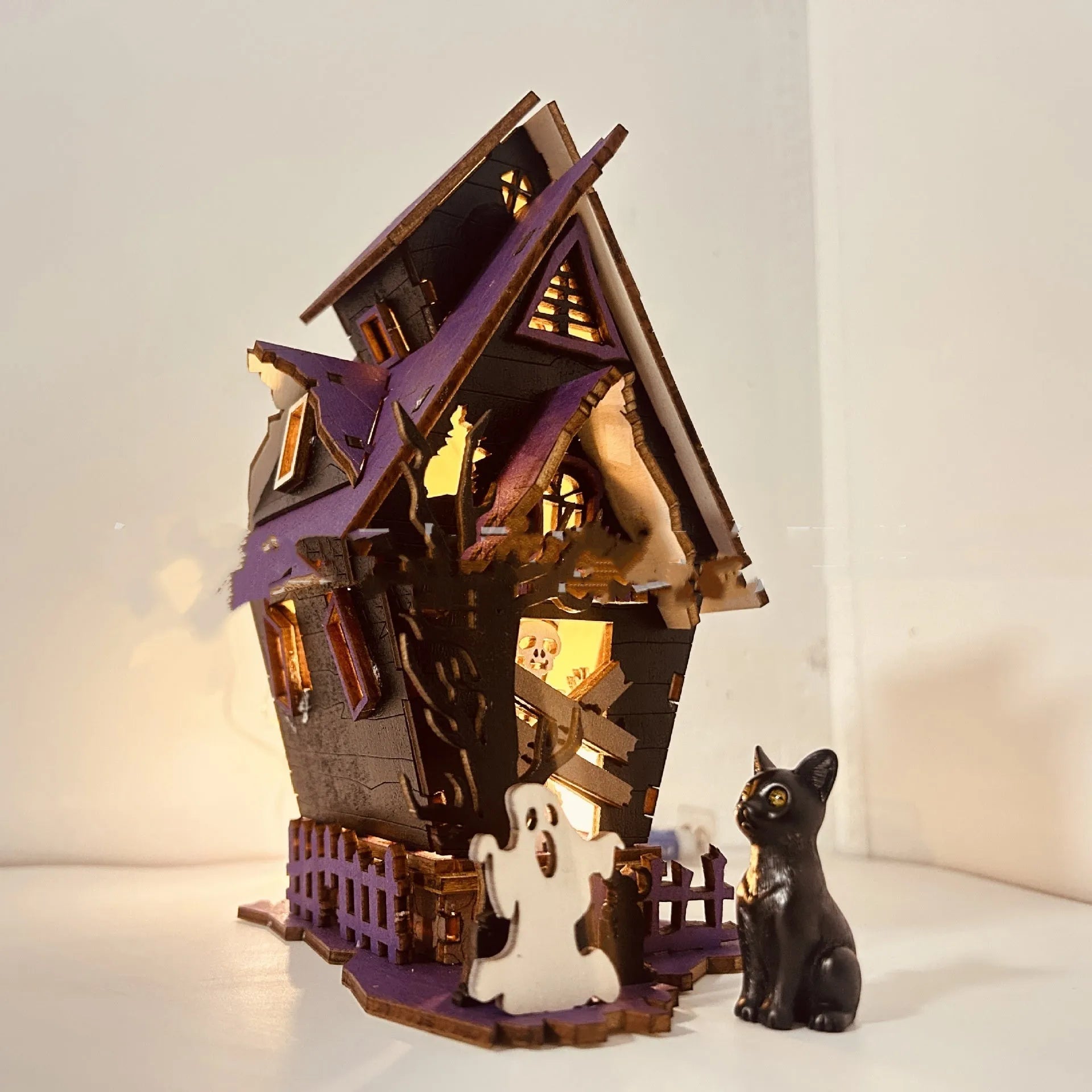 DIY wooden Halloween haunted house decoration kit with luminous design, shown with dimensions 14cm wide by 19cm high.