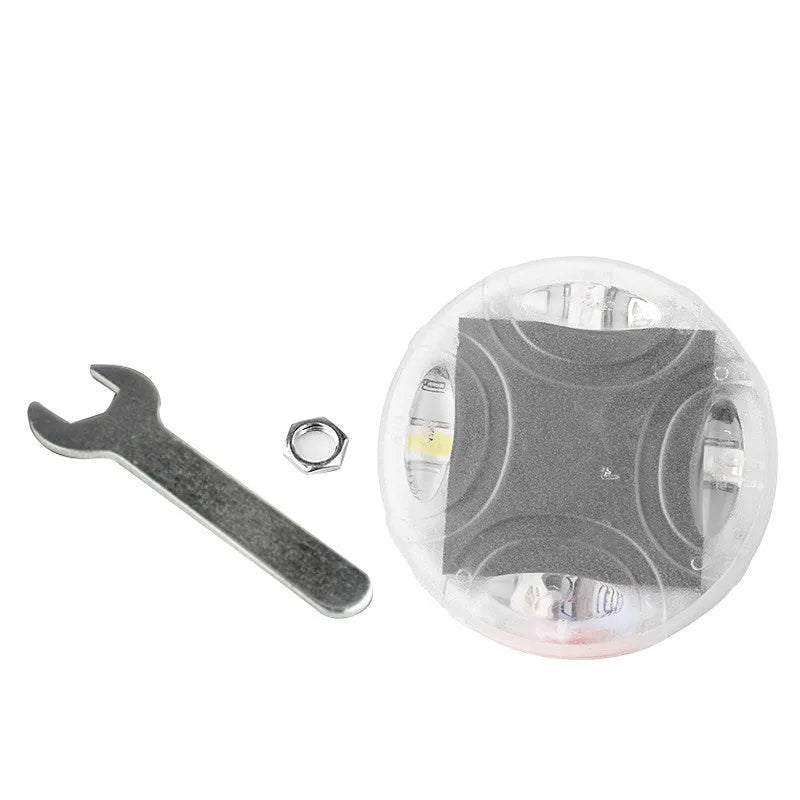 Colourful solar-powered LED valve stem cap light for car or bike wheel.