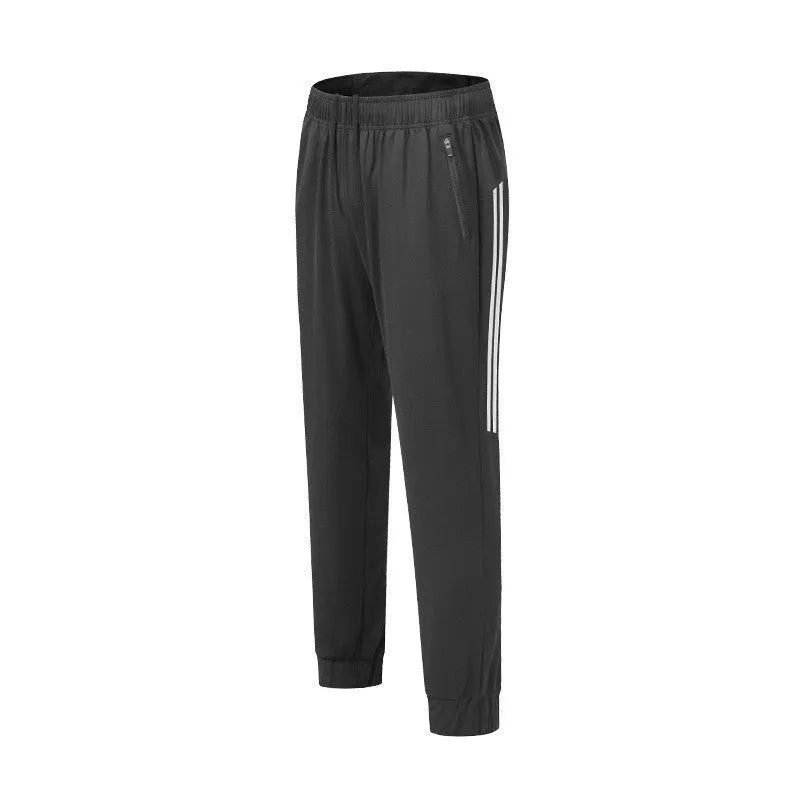 Men's black breathable polyester running trousers with mid-waist fit on a plain background.