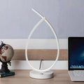 Creative water drop shaped desk lamp in black or white with warm LED lighting