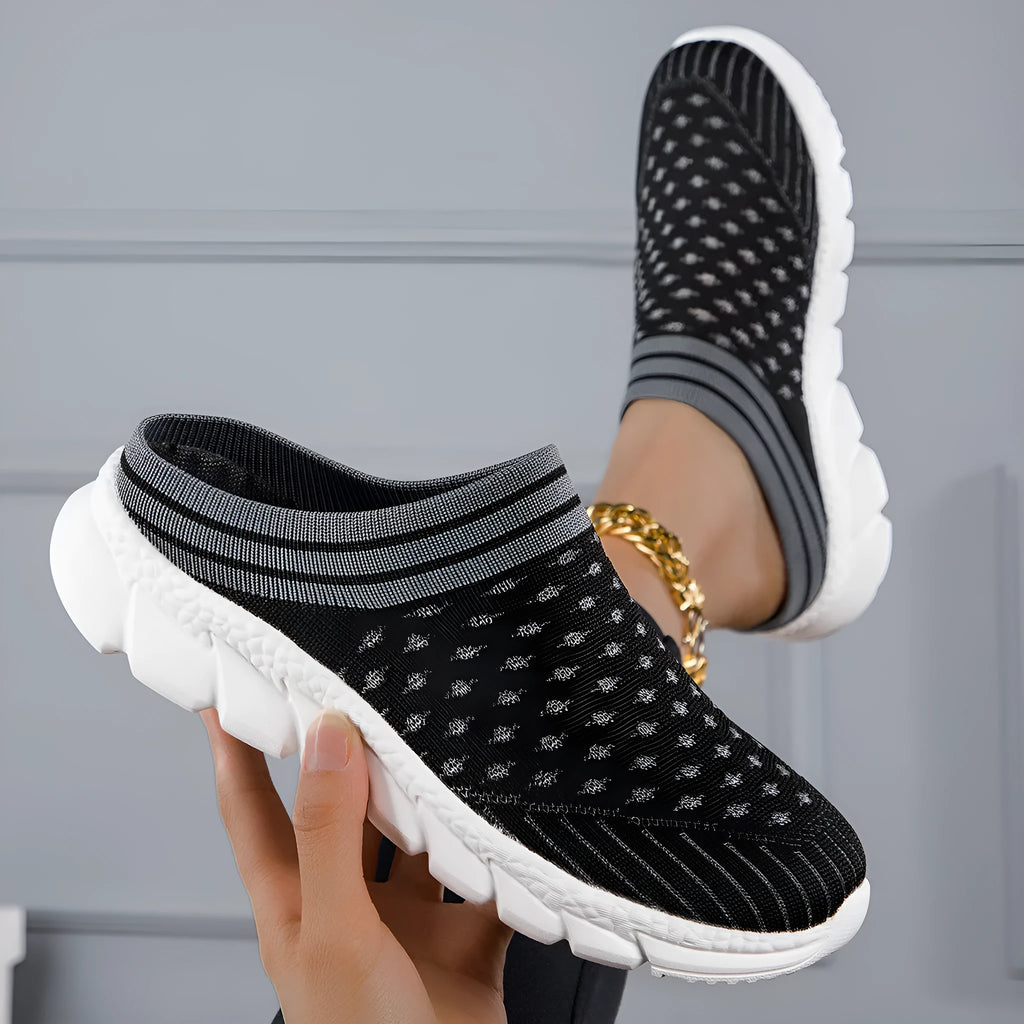 Women's black, pink, and purple Flyknit semi-slipper shoes with striped pattern and hollowed-out design.
