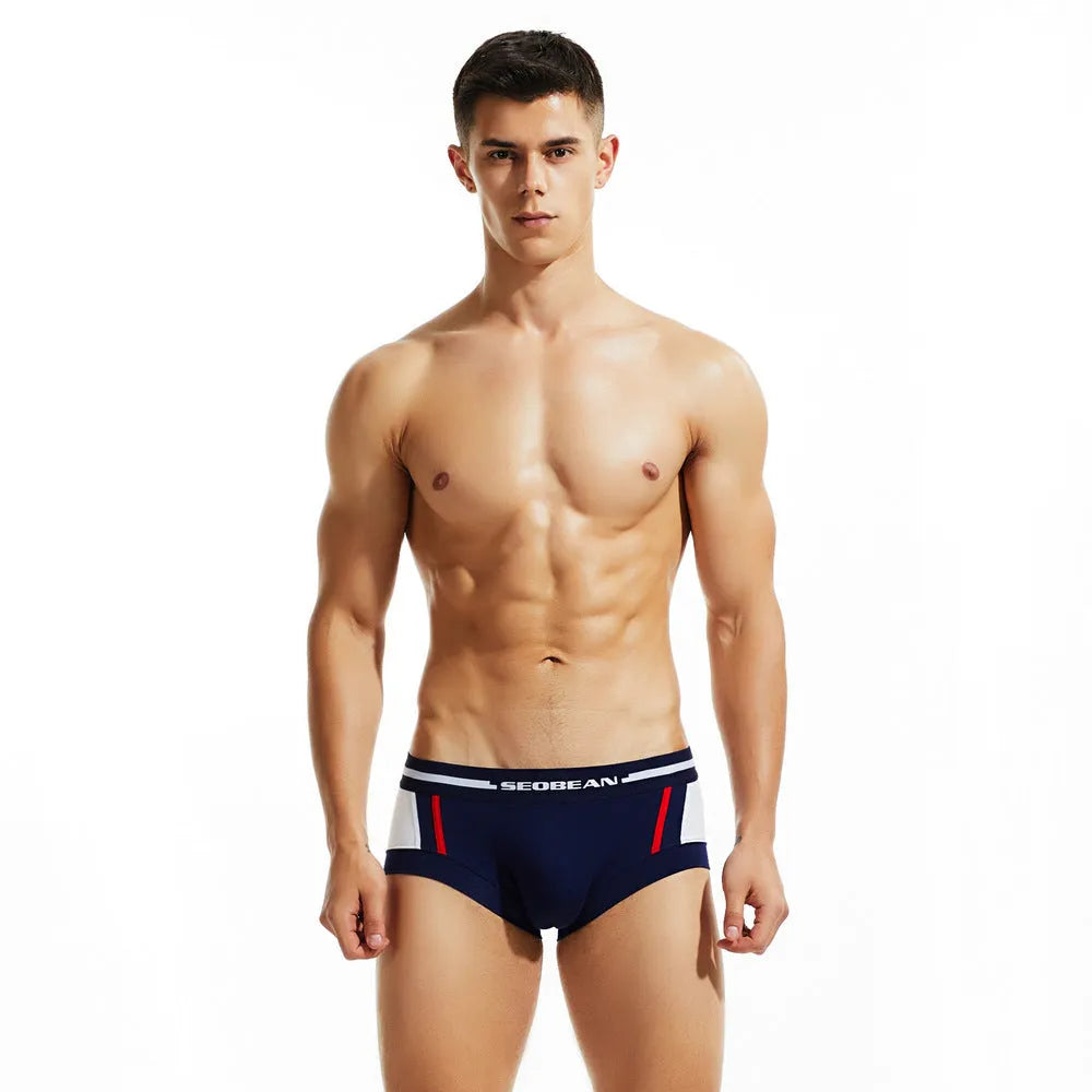 Men's cotton boxers in red, dark blue, and light grey colours showing low waist hip lifting design