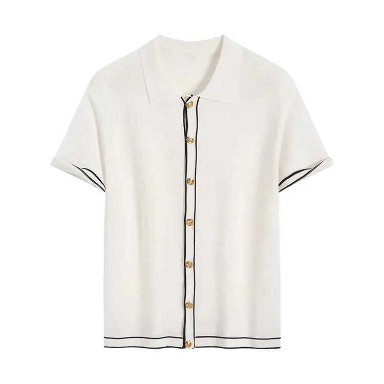 White short sleeve cardigan with dark contrast colour lapels, laid flat to show relaxed fit and button front.