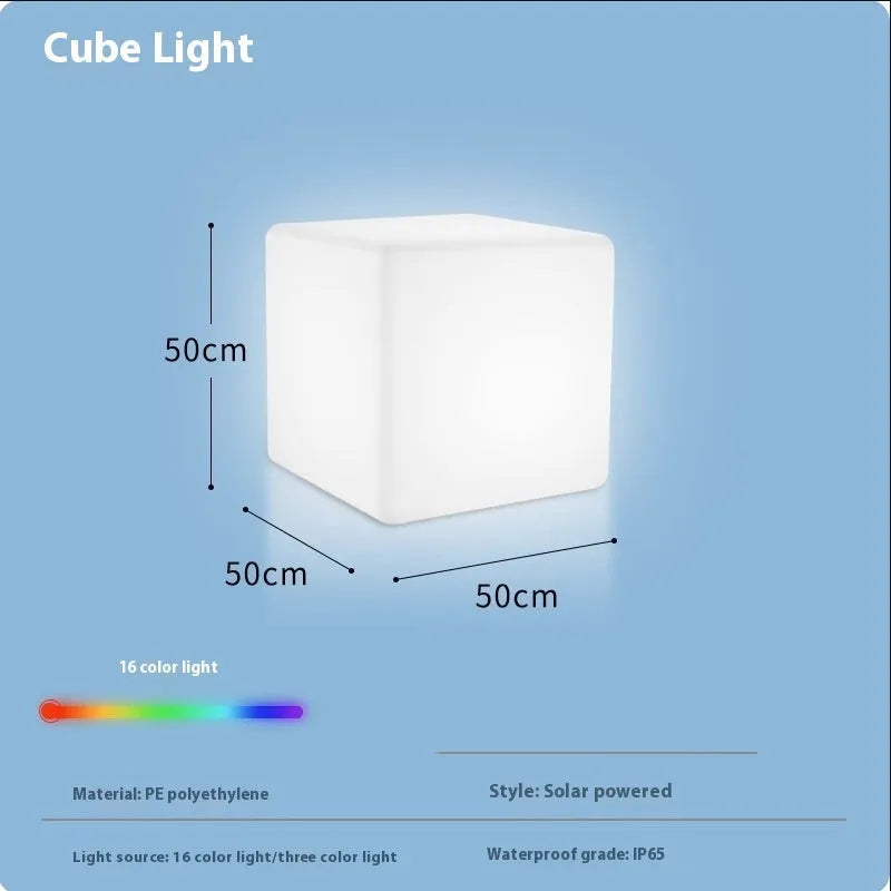 Modern square LED cube light stool in a garden setting, showcasing its clean design and luminous top.