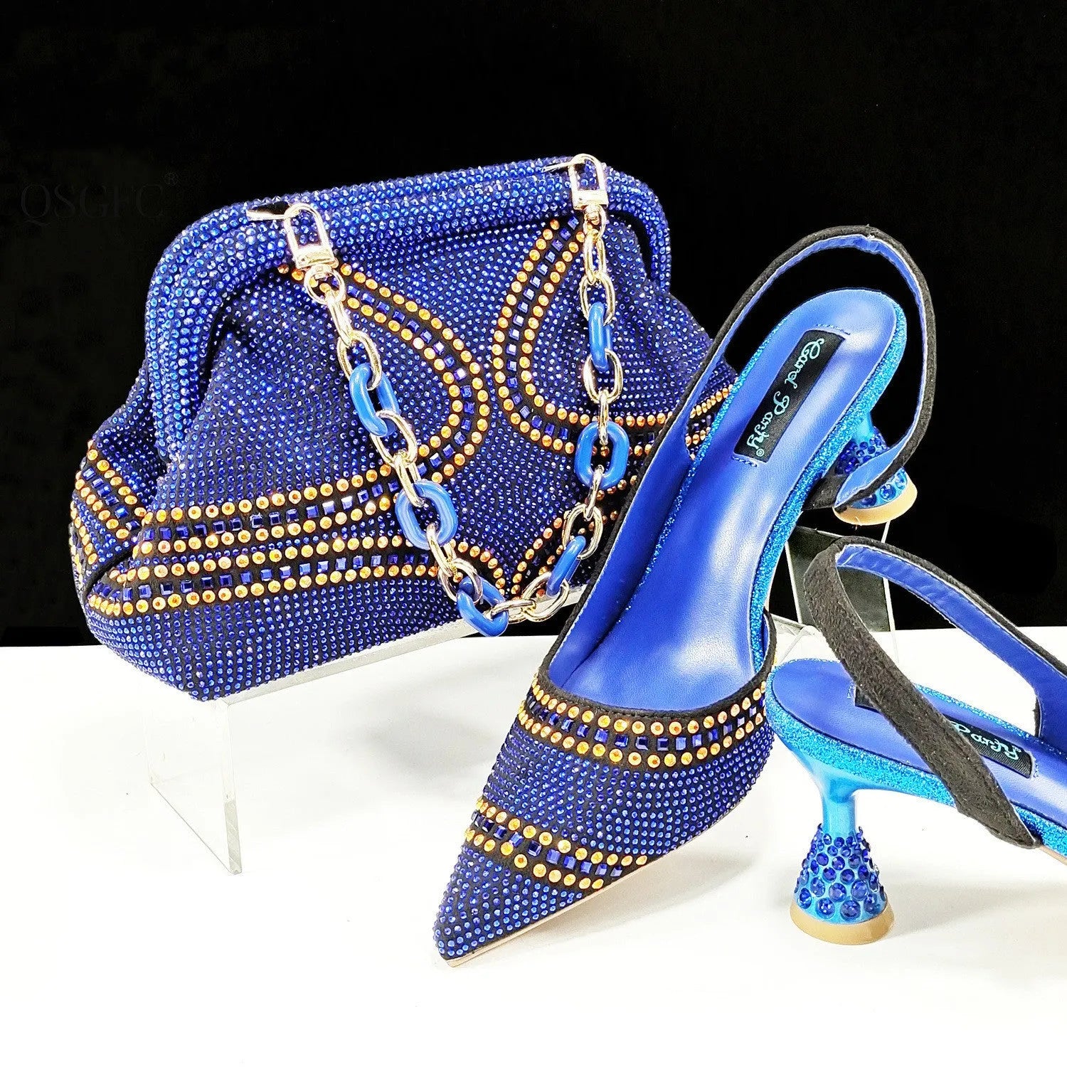 Women's pointed toe high heel shoes with matching small bag in synthetic leather, wine glass heel.