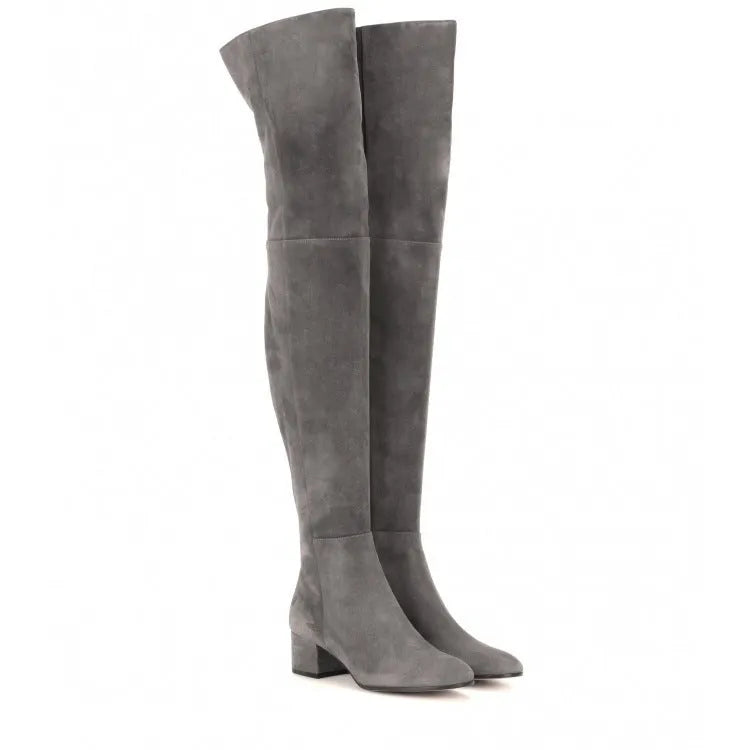 Grey suede women's flat over the knee boots with a pointed toe and thick low heel.