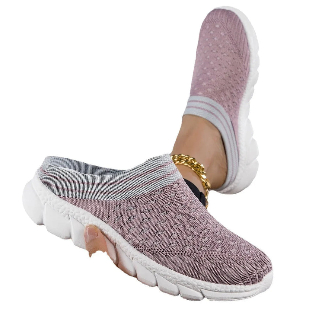 Women's black, pink, and purple Flyknit semi-slipper shoes with striped pattern and hollowed-out design.
